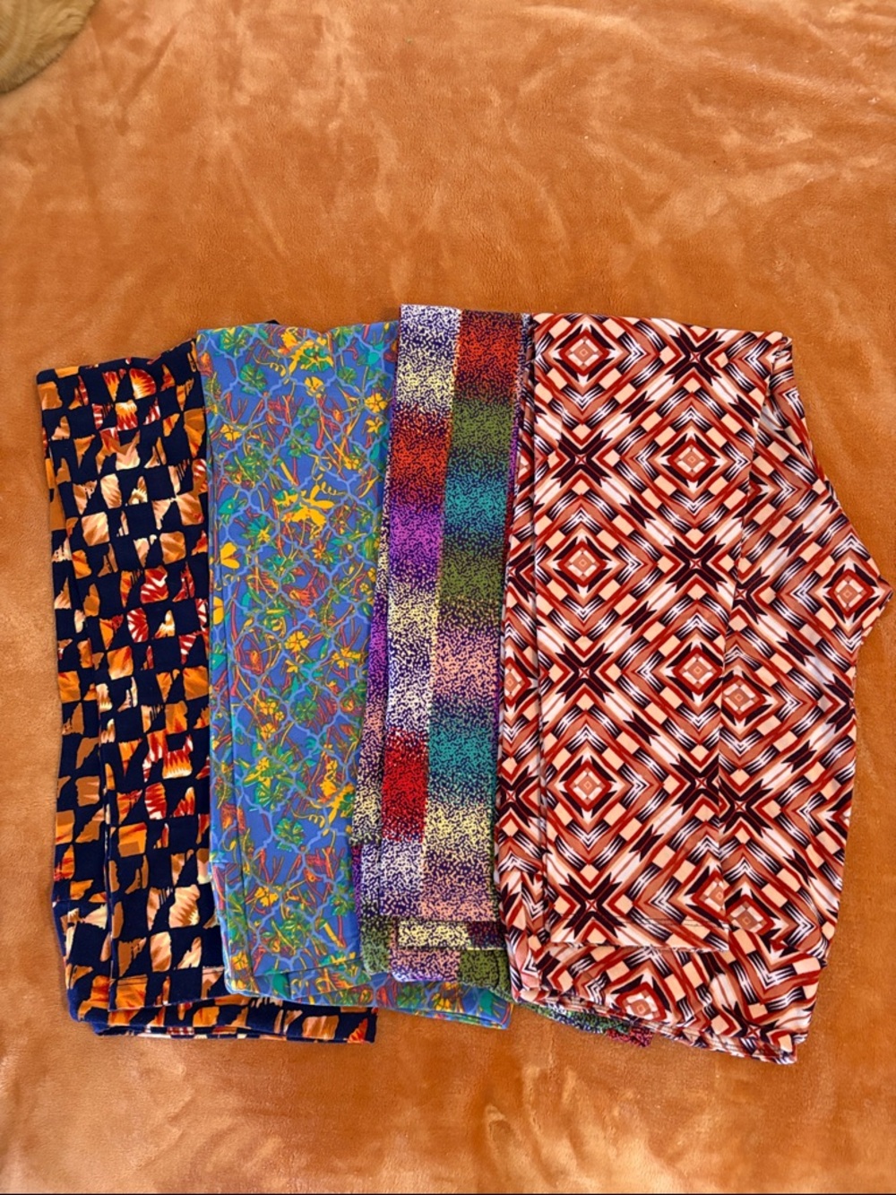 Set of 4 LuLaRoe Print Leggings size Tall and Curvy.